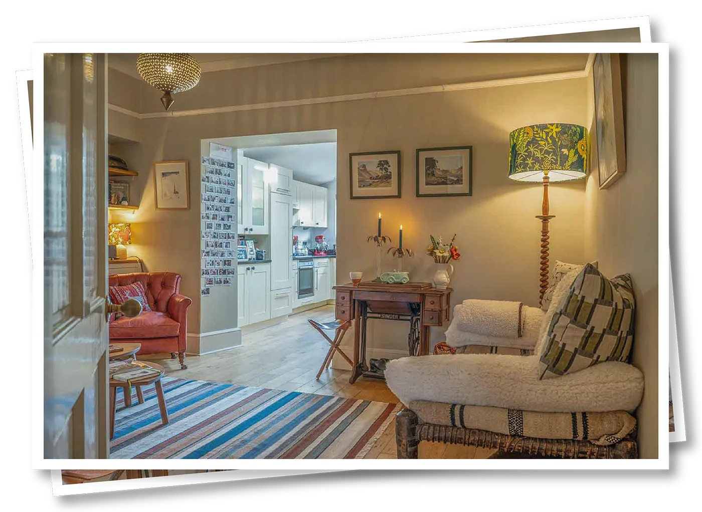 View of the snug and it's cosy armchairs looking towards the open kitchen space
