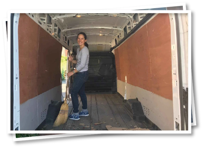 Christel sweeping the removals van after moving belongings into North View B&B in Penrith on relocation day
