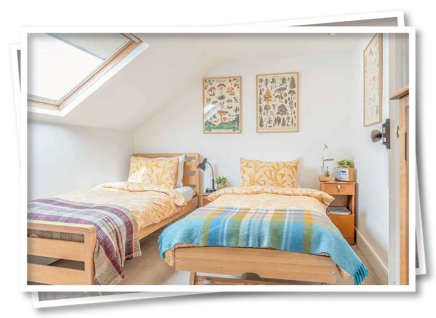 Twin beds in the Orange Herdy Room at North View B&B, Penrith, with bright bedding and a cosy, inviting décor