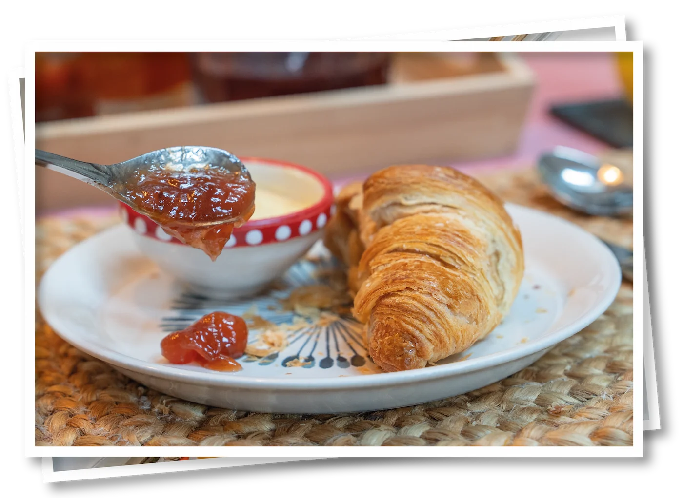 Guest spooning jam onto a croissant at North View B&B, Penrith, as part of a fresh continental breakfast at this Lake District B&B